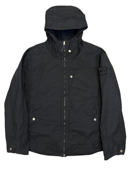 Black jacket on a beige surface