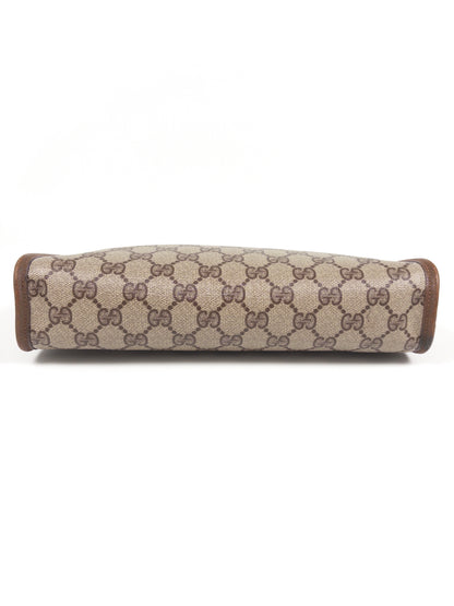 Gucci GG Supreme clutch bag
