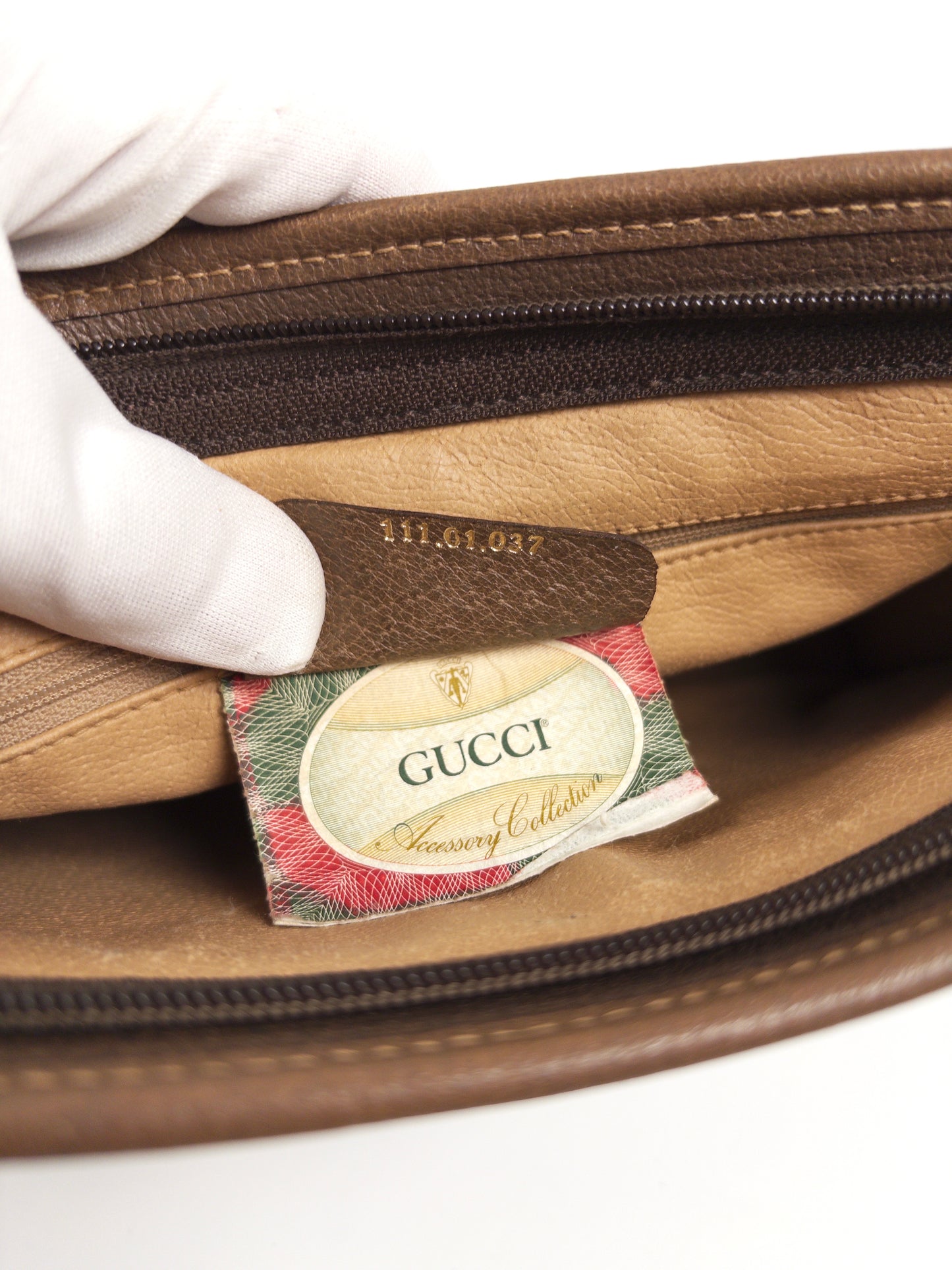 Gucci GG Supreme clutch bag