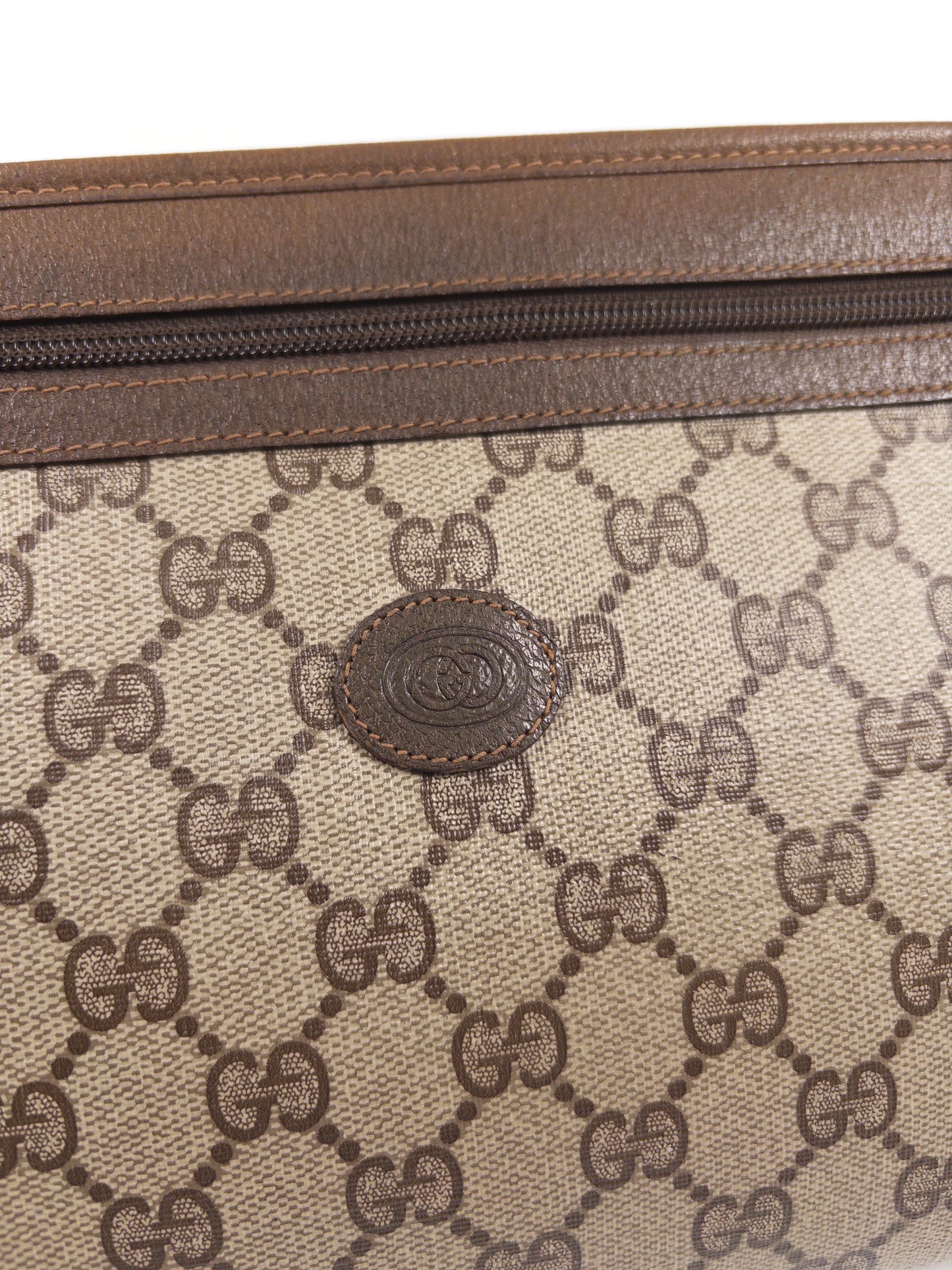 Gucci GG Supreme clutch bag