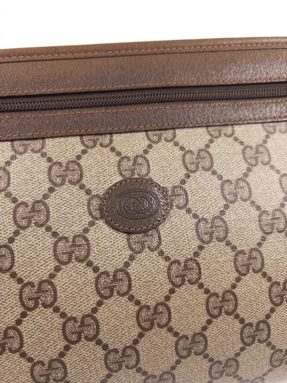 Gucci GG Supreme clutch bag